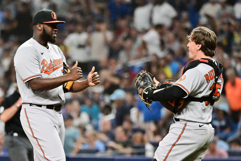 Felix Bautista celebrates with Adley Rutschman of the Baltimore