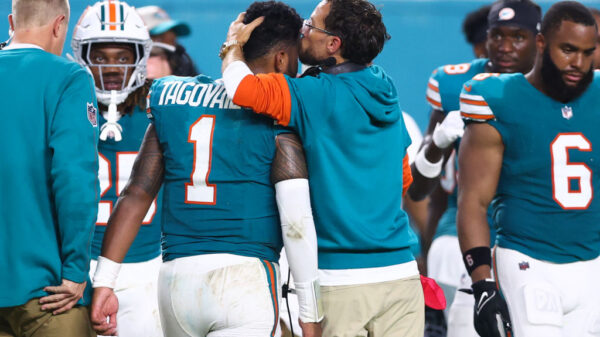 Head coach Mike McDaniel of the Miami Dolphins embraces Tua Tagovailoa