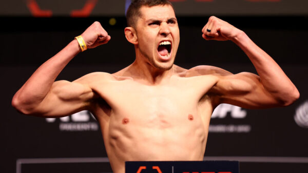 Steve Garcia of the United States poses on the scale ahead of his lightweight bout